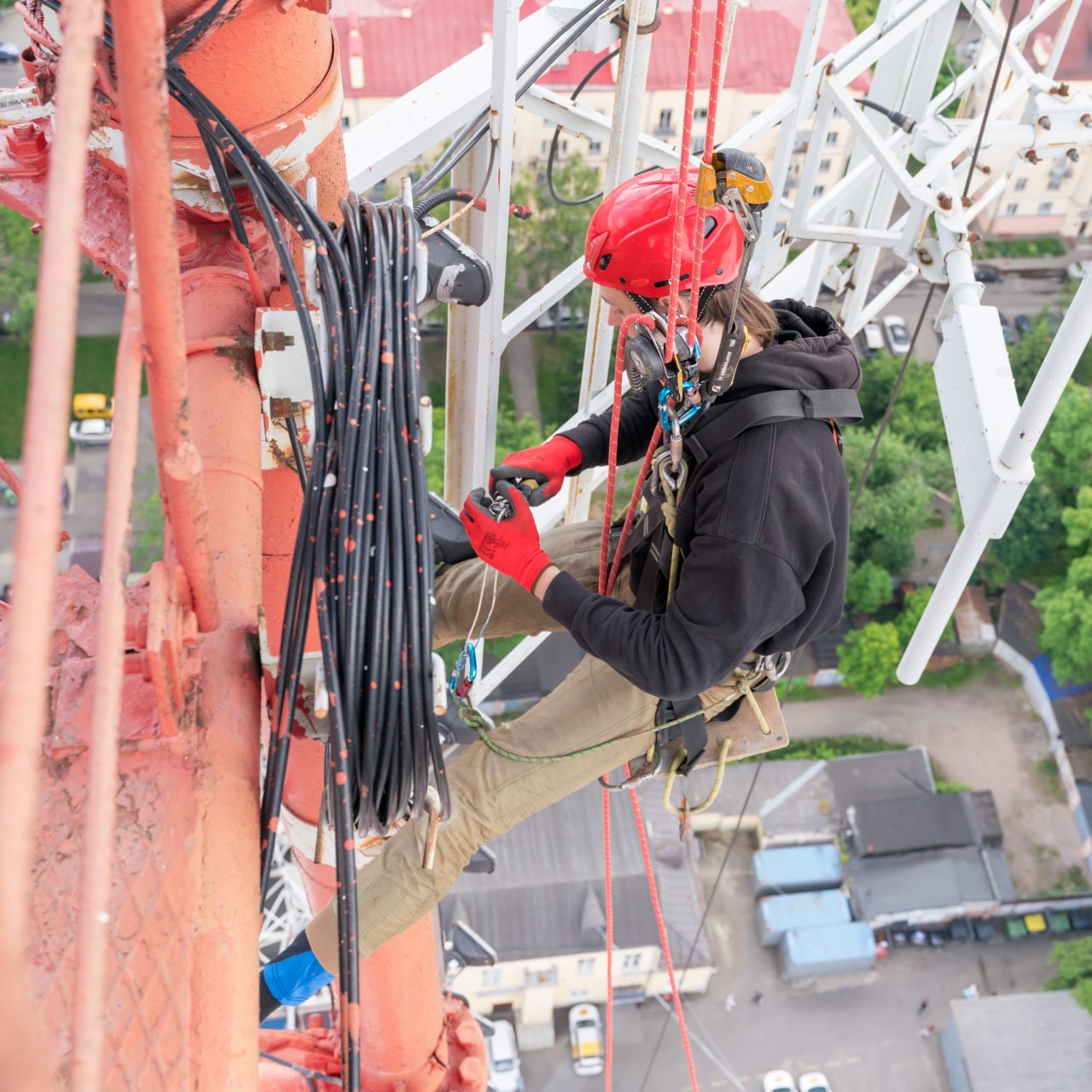 a-worker-with-climbing-equipment-serves-a-city-tv-2025-03-09-07-19-56-utc