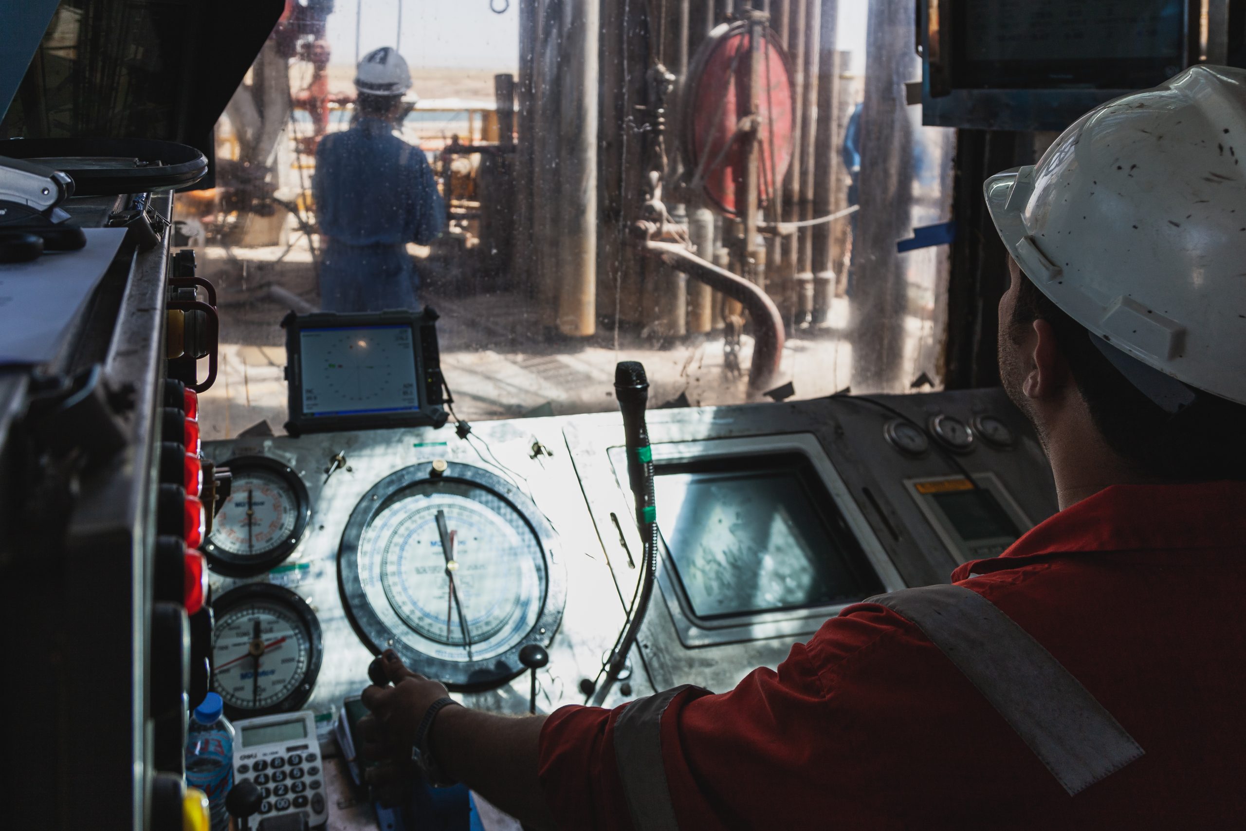 Oil and gas operator at an instrumentation control console