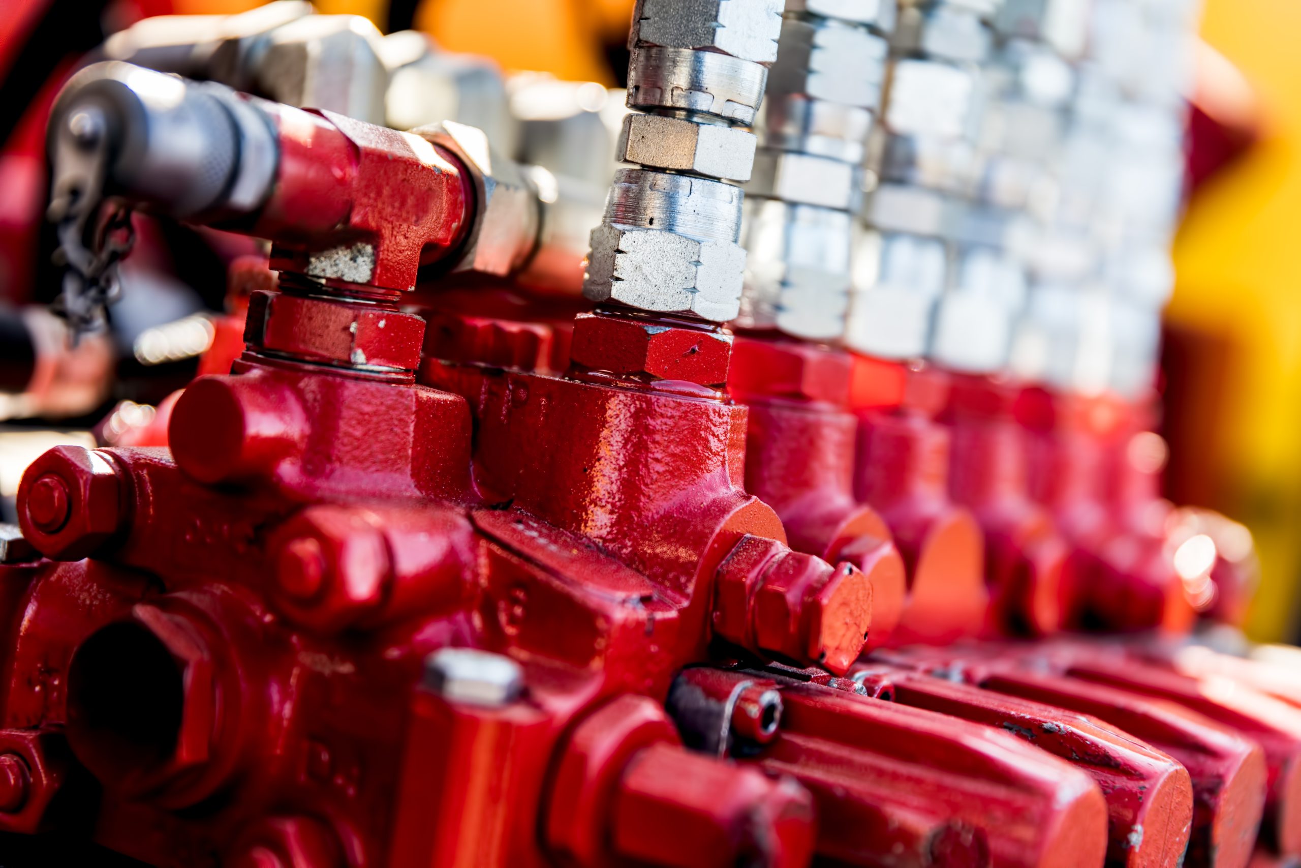 Red valves and silver hydraulic fittings
